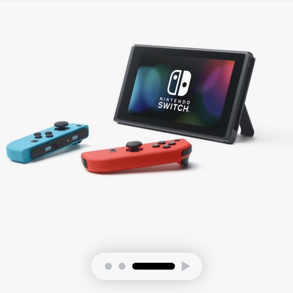 Nintendo Console with Red and Blue Controllers - Picture 1 of 3